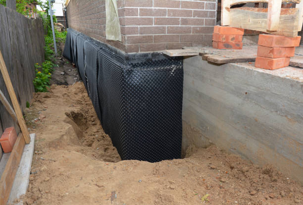 Happy homeowners after waterproofing job in Glen Mills